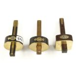 A rosewood and brass mortice gauge by HILL and two ebony and brass mortice gauges G+