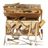 A carrying case containing a kit of leather workers tools incl, plough gauge, knives,