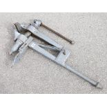 A large heavy leg vice with 5 1/2 " jaws 39" overall G