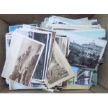 Hundreds of loose postcards, mostly earlier, together with a scrapbook of South Africa cards.