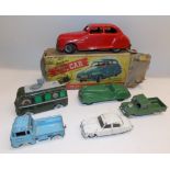 Die cast by Dinky and others together with a Chad Valley clockwork saloon, boxed.