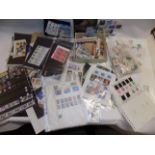 Miscellaneous World stamps, loose, in packets and on leaves etc.