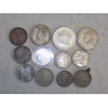 Twelve World silver coins.