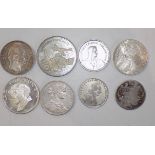 Eight World silver coins.