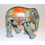 A German clockwork Blomer and Schuler "Jumbo Tin Plate Elephant", made in US zone Germany, age wear,
