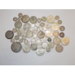 A collection of mainly silver world coins including a Theresa Thala.