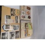 A scrap album containing postcards and photo's, mainly foreign holiday views,