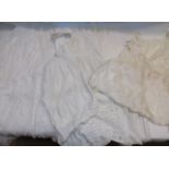 Two baby's christening gowns and two day dresses.