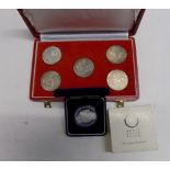 Austria:- A red case with four of five 100 shilling 1979 coins and one other dissimilar 100