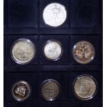 Seven silver coins:- USA $1 1923 and 2000, Canada $1 2000, South Africa 5/- 1952 (.