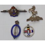 Four silver coloured medal badges:- Judge Advocate General, Royal Navy,