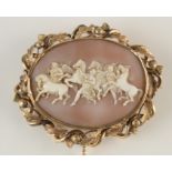 A 19th century large oval cameo brooch showing wild horses and mythical figures in a gold thistle