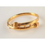 A Victorian Revivalist 9ct gold hinged bracelet, 9.9g.