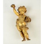 An early 19th century continental gilt bronze figure of a boy, emblematic of autumn,