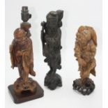 Three Chinese carved wood figures of immortals, 19th century, heights 36cm, 32cm and 30cm.