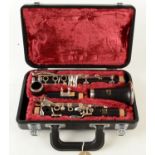 A Yahama clarinet, in a fitted maroon fabric lined case.