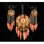 A high purity gold pink coral and seed pearl brooch with matching earrings, each pierced,