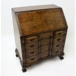 A George II style walnut bureau,