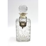 A silver mounted cut glass decanter,