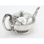A fine plain silver bachelors teapot by William Hutton & Sons Ltd with scrolling handle and reeded