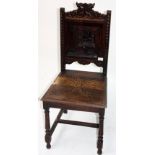 A Victorian carved oak hall chair, height 99cm, width 45cm.