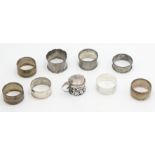 Eight various silver napkin rings and a pierced silver mustard pot, 4.3oz, with blue glass liner.