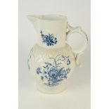 A massive 18th century Caughley blue and white cabbage moulded jug with mask spout,