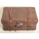 A Victorian brown leather trunk, initialled C.ST J.C., height 34cm, width 79cm, depth 50cm.