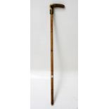 A bamboo cased sword stick, with antler handle, total length 96.5cm.