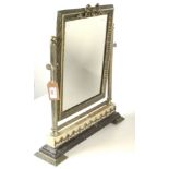 A metal dressing table mirror, the rectangular plate flanked by reeded columns, height 55cm,