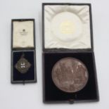 A Wyon large bronze medal showing an English classical interior to the obverse,