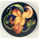 A Moorcroft pottery `Snapdragon` pattern coaster, shape 780, by Emma Bossons,