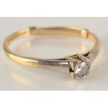 An 18ct yellow gold solitaire diamond ring.