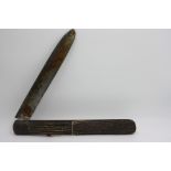 A massive Victorian folding knife, the scales formed from four antler sections,