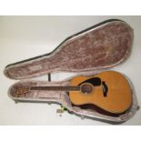 A Yamaha accoustic guitar, LD10, length of back 51cm, in a hard case.