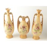 Austrian porcelain three vase garniture with pierced necks and twin handles, damage.