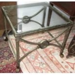 A metal coffee table, with a glass top on square section legs and claw feet, height 54.5cm, 63.