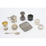 A cased three piece silver christening set comprising an egg cup, spoon and napkin ring,