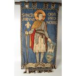 A hanging embroidered banner, inscribed 'Sancta Joanna ora pro nobis',