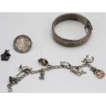 A post-war silver bangle, a silver articulated crocodile pendant,