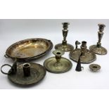 Three chambersticks, a pair of Sheffield plated candlesticks and an entree dish.