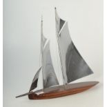 A coromandel and white metal model of a yacht, mid 20th century, height 42cm, width 46cm.