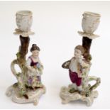A pair of Dresden style late 19th century candlesticks, in Rococo style,