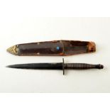 A Fairbairn-Sykes knife, by William Rodgers, Sheffield, England, in leather scabbard, length 30cm.