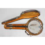 An American Remo Weather King five string banjo, with brown leather case, length 93cm.