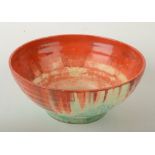 A Clarice Cliff 'Red Roofs' pattern bowl with ribbed body chipped, diameter 22.4cm.