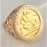 A 9ct. gold ring set a Victorian 1896 half sovereign, 8.8g.