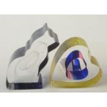 Two Kosta Boda paperweights, one a heart,