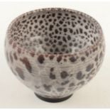 A Bruce Chivers bowl, with flambe glaze breaking through white, height 11.5cm, impressed mark.