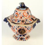 An Iron Stone China pattern 22, hexagonal section sauce tureen with mask handles,